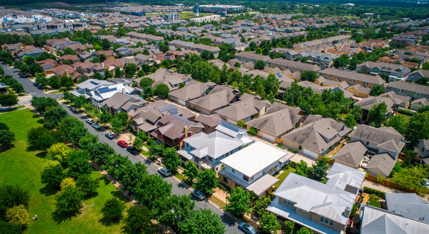 An aerial view of a residential neighborhood, representing the PropSpectrum real estate suite